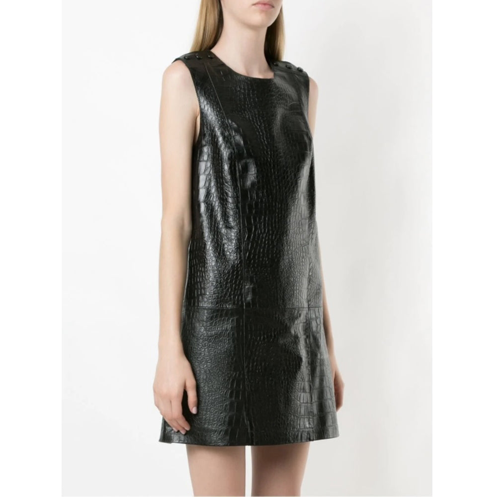 Side profile of a women's sleeveless crocodile-embossed leather mini dress in black, highlighting its textured pattern and sleek A-line silhouette.